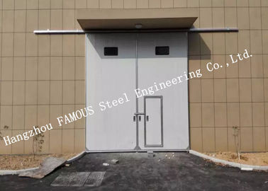 Porcelana Puertas industriales de desplazamiento horizontales seccionales del garaje con la puerta peatonal del acceso para el taller proveedor